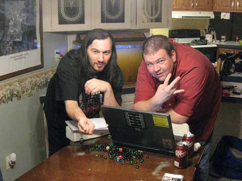 Nathan Stout and Chris McGinty thowing netrunner bits and shooting the ATW gang sign during the according to whim photo shoot.