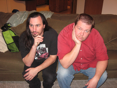 Nathan Stout and Chris McGinty shooting photos for the television show according to whim looking serious